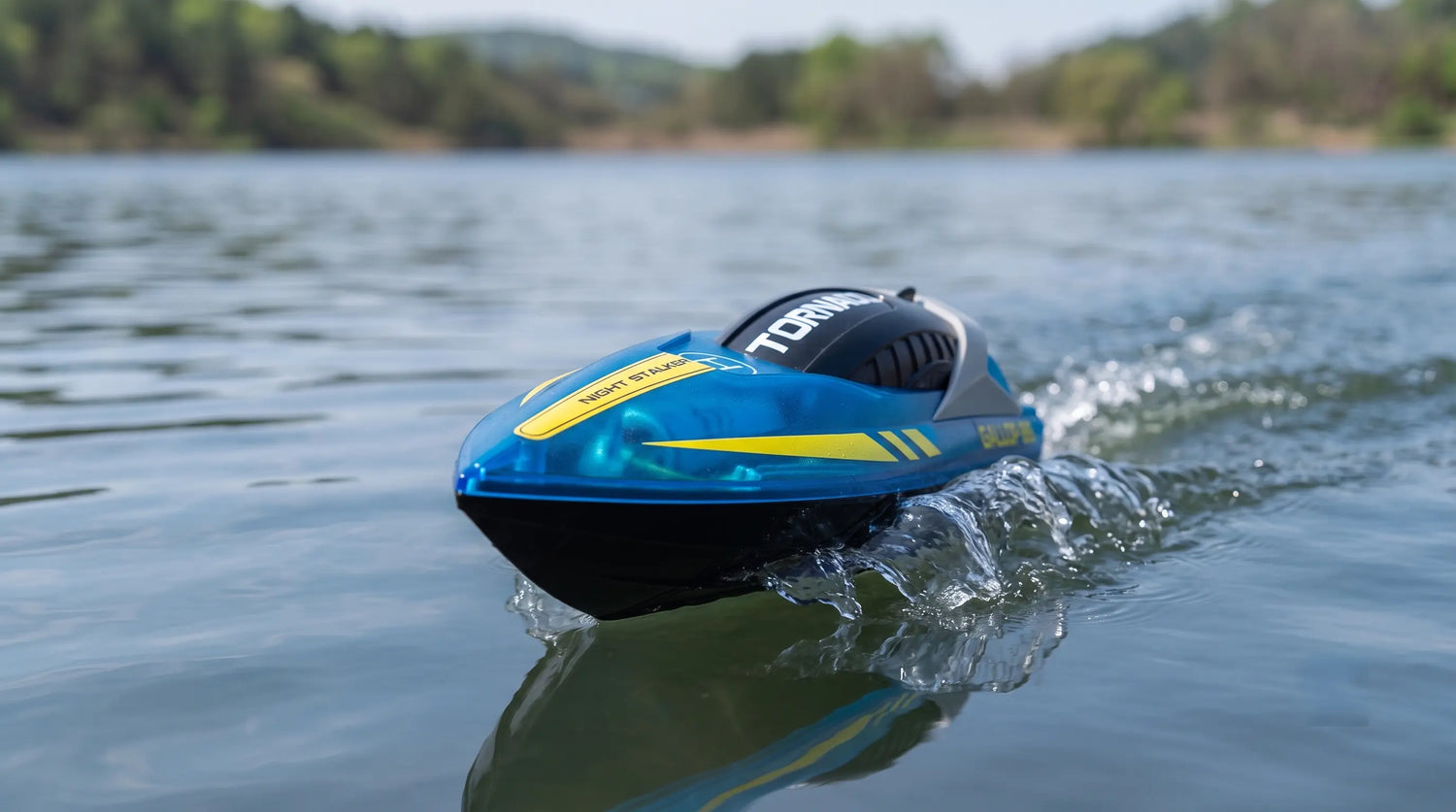 Low angle close-up of the Gallop 819 speed RC boat V-hull showing translucent blue polycarbonate and black bottom design.