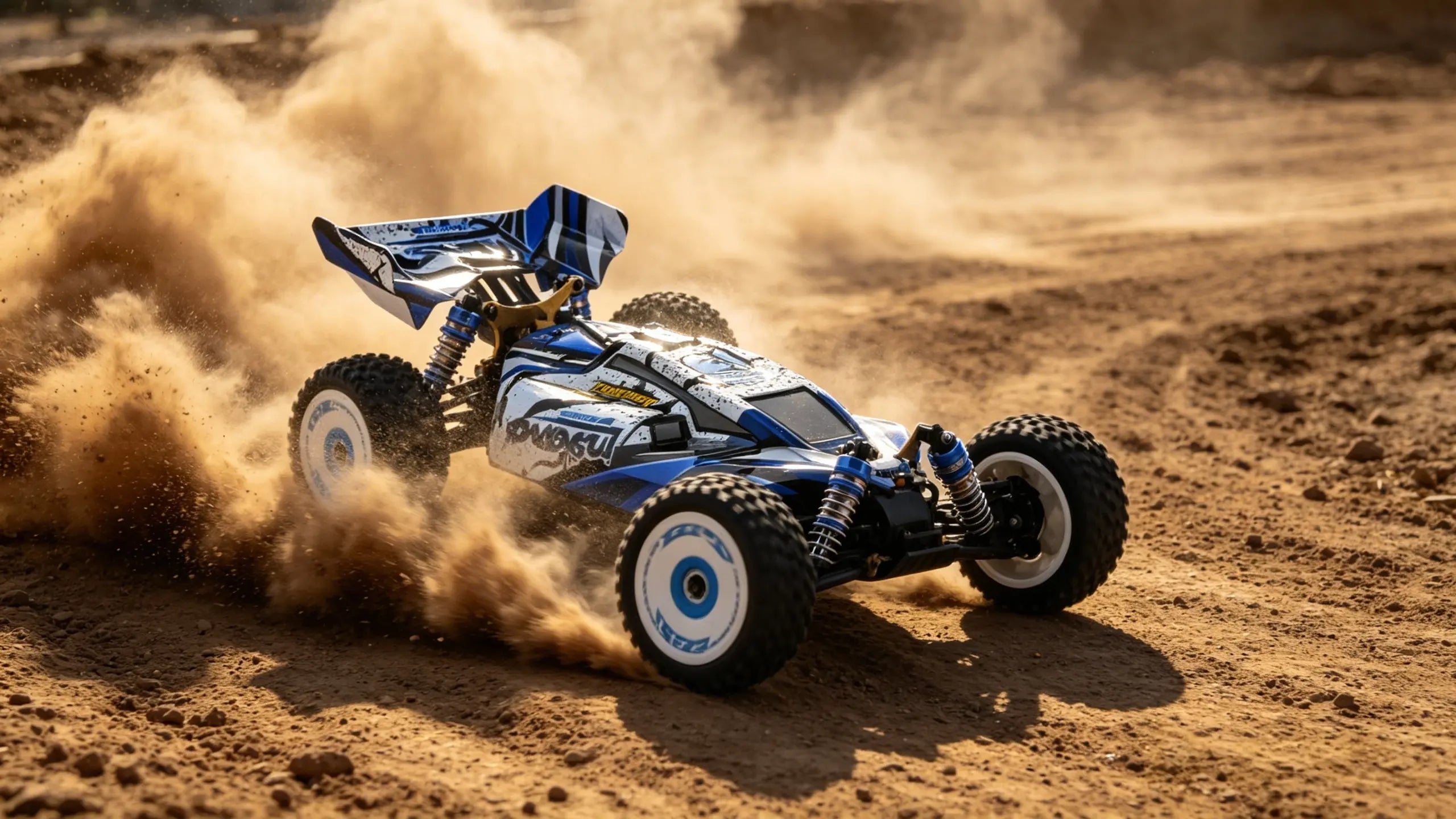 A blue and white RC car performing a high-speed Drifting Off-Road maneuver, with its tires throwing up a rooster tail of dust on the sandy surface.