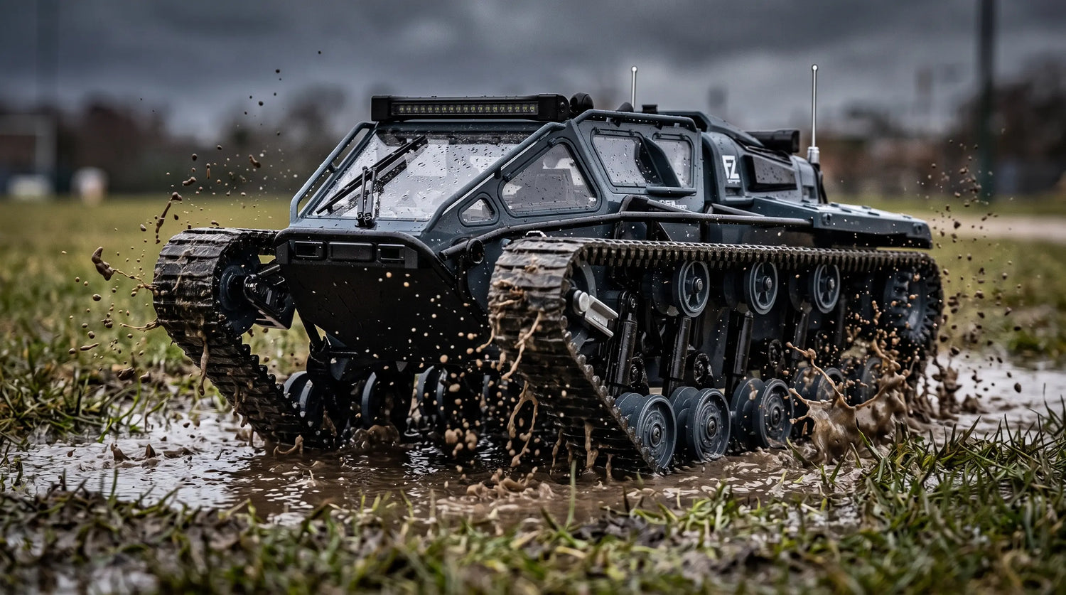 A dark grey RC tracked tank splashing through a muddy puddle on wet grass.