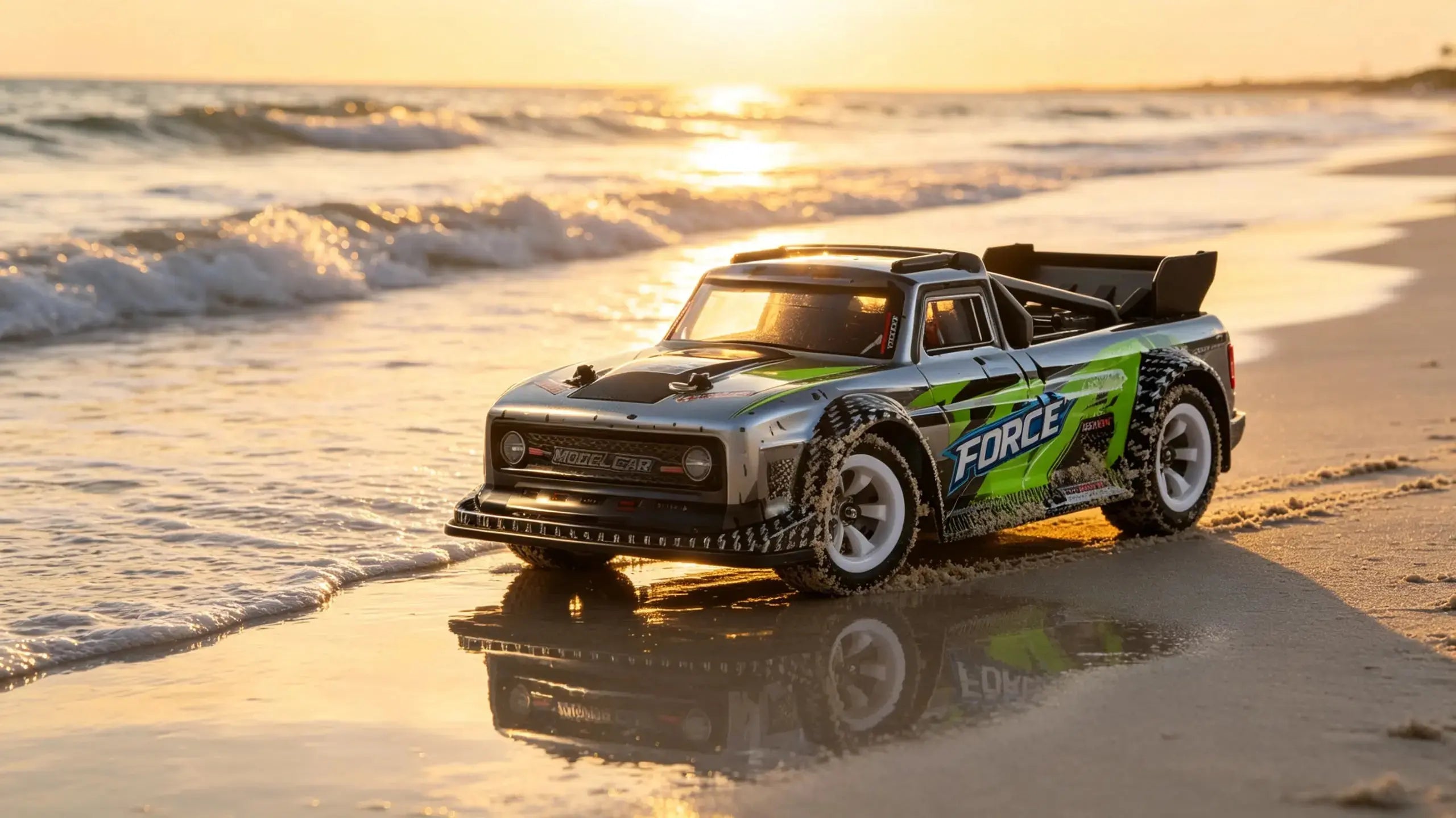 The cool "FORCE" drift RC car on a sunset beach with ocean waves in the background, showcasing the thrill of outdoor RC driving.