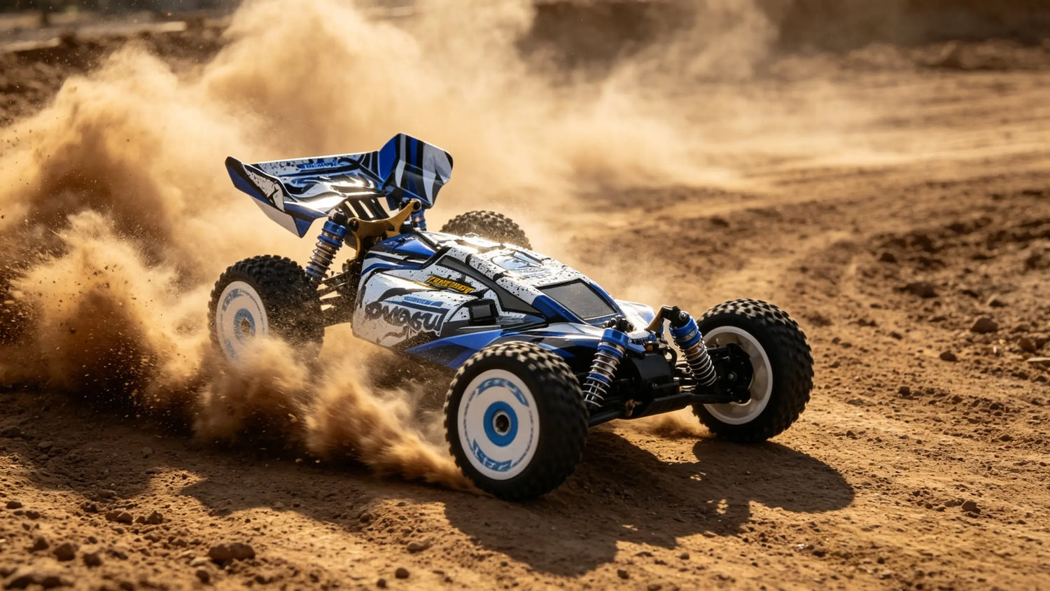 A blue and white RC car performing a high-speed Drifting Off-Road maneuver, with its tires throwing up a rooster tail of dust on the sandy surface.