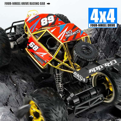 PLAYPULSE 4WD off-road RC truck climbing rocky terrain with bright red and yellow frame