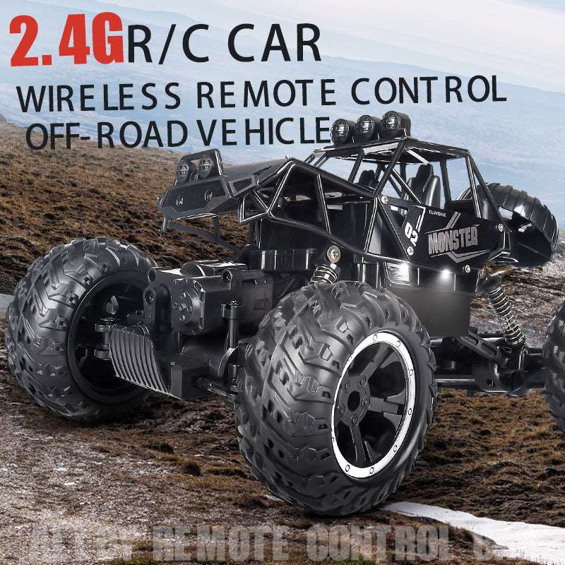 PLAYPULSE wireless remote control off-road car with large tires and black rugged frame on rocky terrain