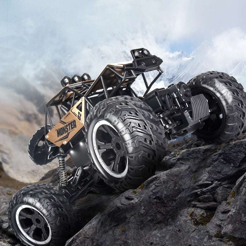 PLAYPULSE wireless remote control off-road car climbing rocky terrain with large tires and rugged design