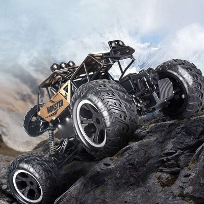 PLAYPULSE wireless remote control off-road car climbing rocky terrain with large tires and rugged design